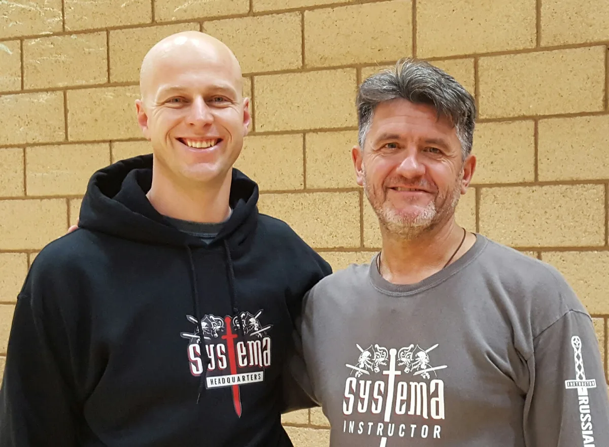 Mike Cameron on the left with Vladimir, both smiling in Systema shirts